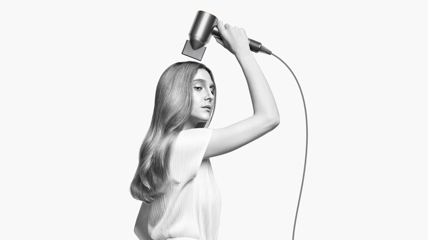 Model using Dyson Supersonic™ hair dryer 